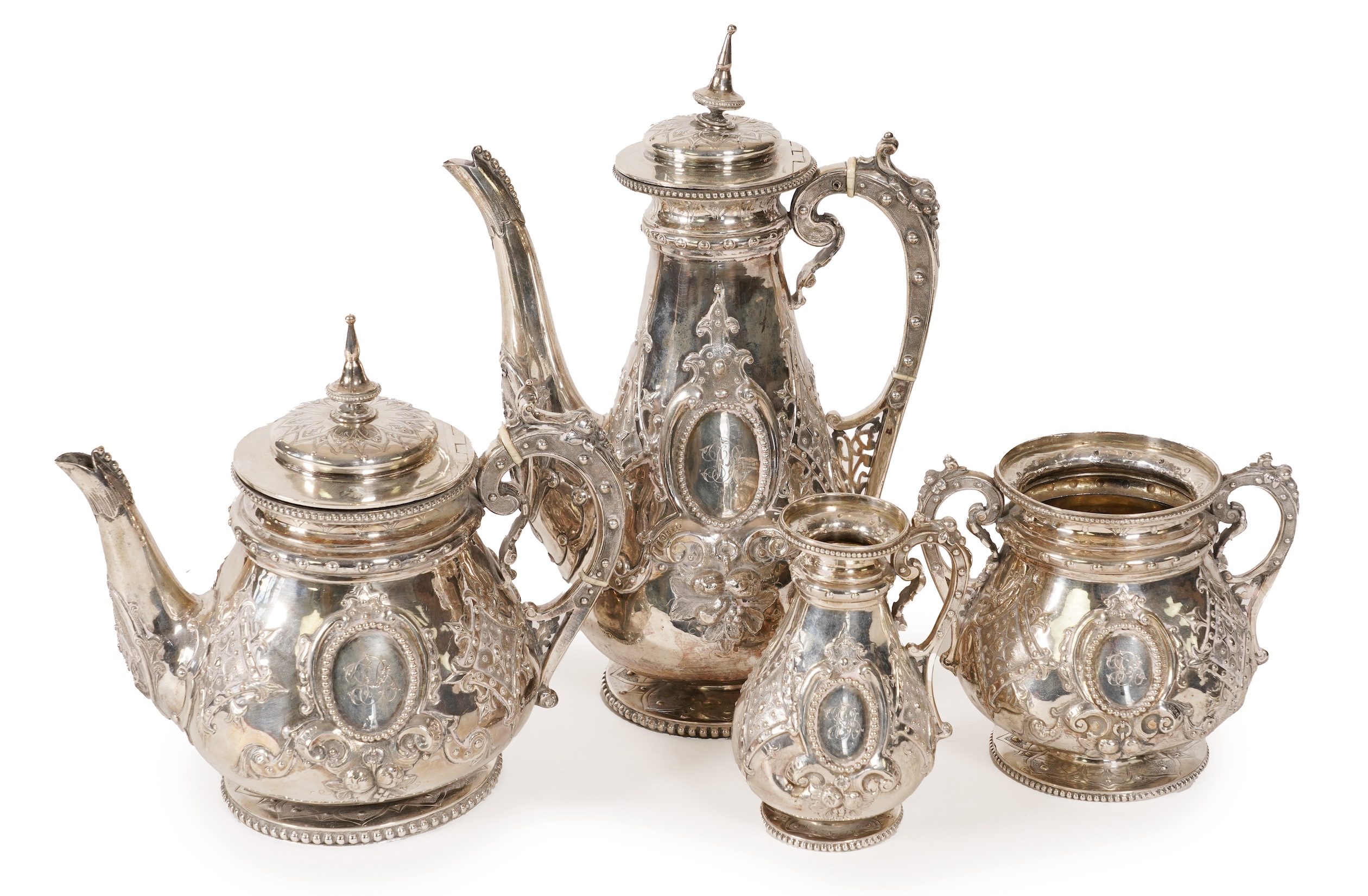 A Victorian ornate silver four piece tea and coffee service, by Thomas Smily